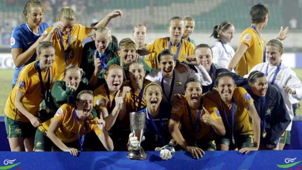 The jubilant  Matildas - Australia's women's soccer team - at the presentation to receive the Asian Cup they won in a dramatic final in China this week.