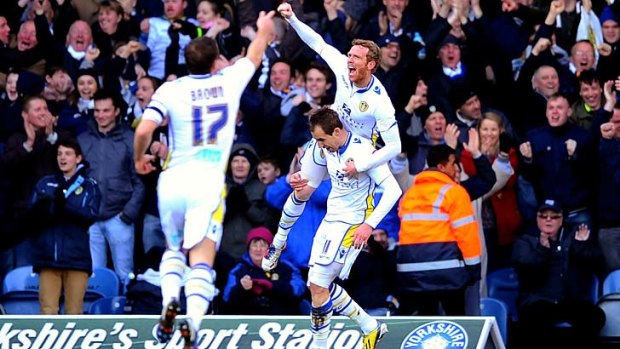 Luke Varney of Leeds is congratulated by teammate Paul Green after scoring the opening goal.