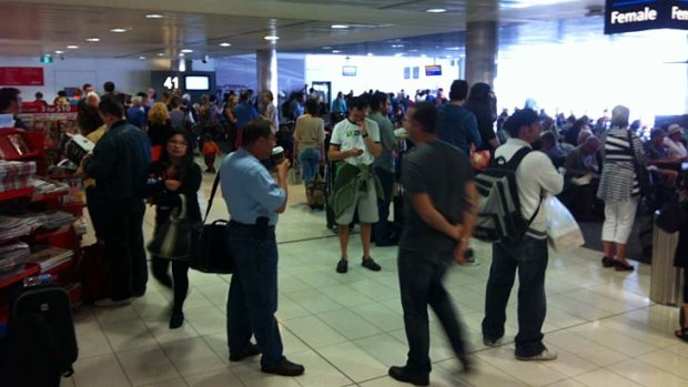 Chaos at the T2 check-in at Sydney Airport.