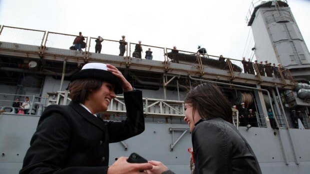Marissa Gaeta returns from 80 days at sea and greets her girlfriend Citlalic Snell, to give her the coveted "first kiss" on the pier, following  the repeal of the US military's "don't ask, don't tell" rule.