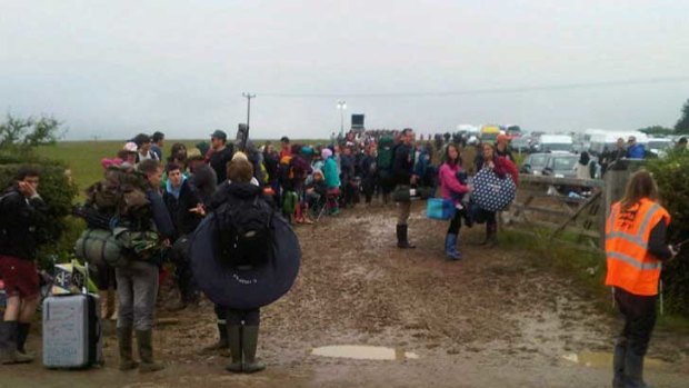 Isle of Wight Festival organiser John Giddings tweeted a photo of stranded and soggy music fans who were forced to wait in their cars or on ferries for more than 10-hours.