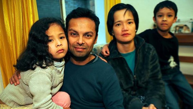 Coping: Rohitha Rupesinghe and Mifon Lew with their children, Emily, aged 7, and Thomas, 9.