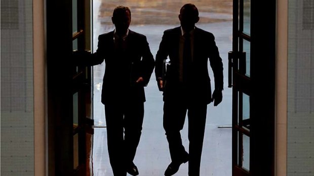 Guess who?: Leaders of the House Christopher Pyne and Prime Minister Tony Abbott enter Parliament for question time on Thursday.