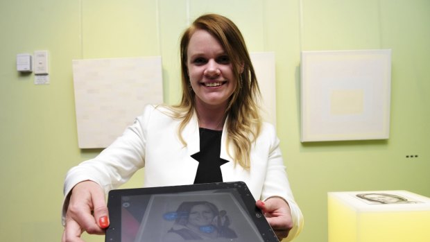 Amber Standley, 30 at the Think. Create. Innovate. Canberra exhibition with her augmented reality app.