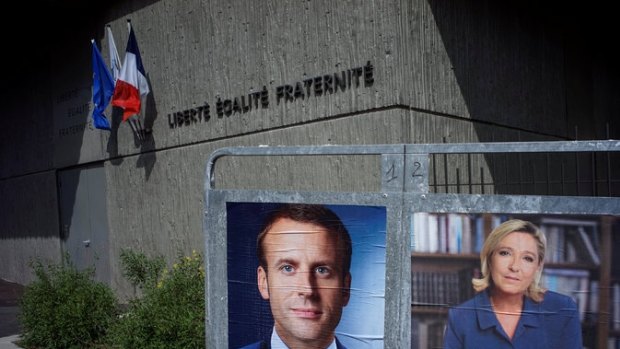 Posters for Emmanuel Macron and Marine Le Pen in advance of France’s presidential runoff election.