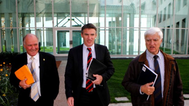 Tony Windsor, Rob Oakeshott and Bob Katter in Canberra yesterday.