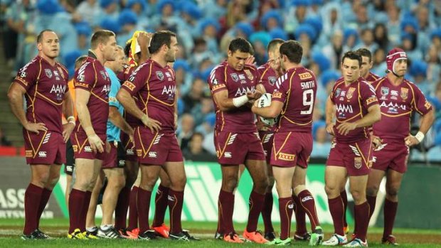 State of dejection: Queensland during their defeat in the Origin opener at ANZ Stadium earlier this month.