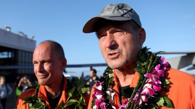 Pilots Bertrand Piccard (left) and Andre Borschberg talk to the media after the Solar Impulse 2 airplane, piloted by Borschberg, landed at Kalaeloa Airport.