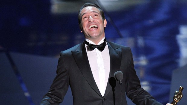 An ecstatic Jean Dujardin accepts his Oscar for his performance in <i>The Artist</i>.