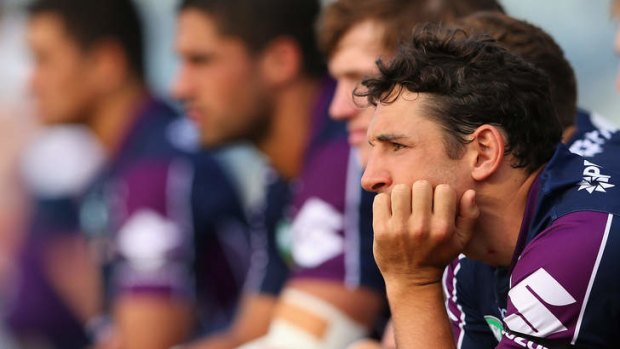 Billy Slater of the Storm watches from the sidelines during the NRL trial match against the Raiders.