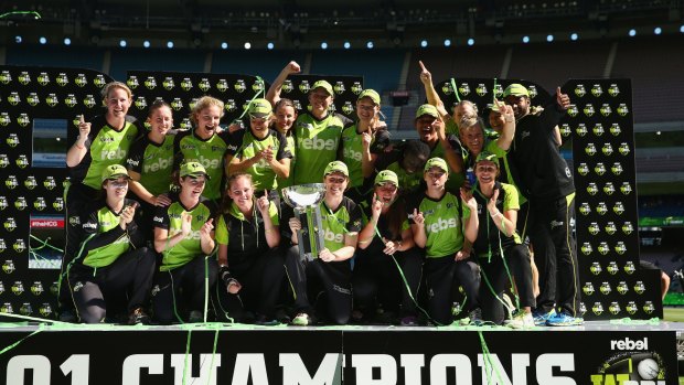 Champions: Sydney Thunder celebrate after they defeated the Sixers during the Women's Big Bash League final at the MCG in January.