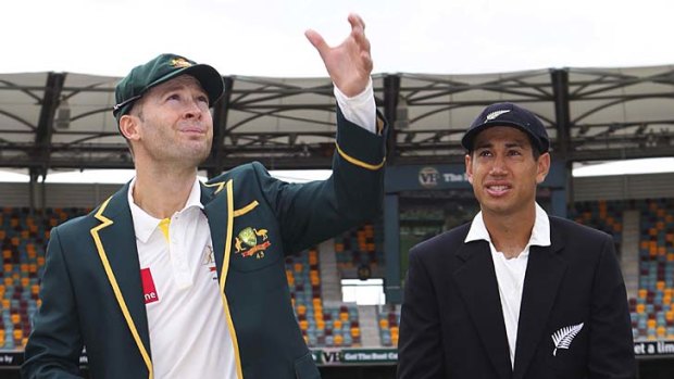 Australia's captain Michael Clarke tosses the coin next to New Zealand's captain Ross Taylor.