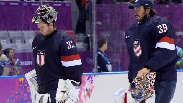 Jonathan Quick (L) and Ryan Miller leave the ice after losing the bronze medal game.