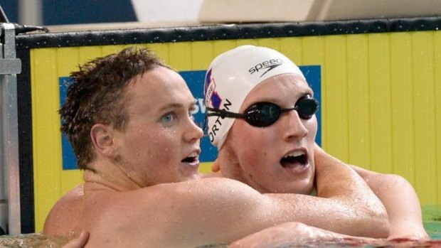 Mack Horton (right) with David McKeon after the latter won the 400m freestyle final in Brisbane last Tuesday.