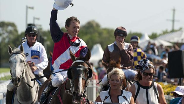 Magic day ... Michael Cahill cheers after riding Real Surreal to victory on Saturday.