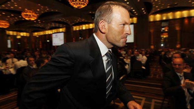 Tony Abbott runs to the stage during an Australia-Israel Chamber of Commerce lunch at Crowne Plaza.