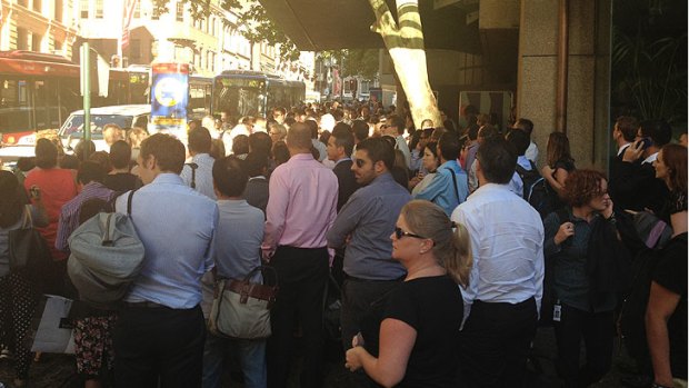 Commuters wait for buses on Druitt Street.