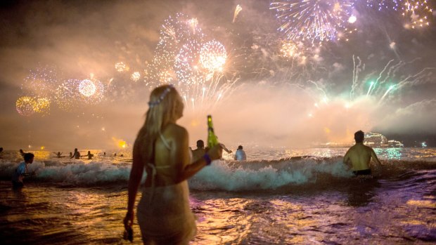 Fireworks light the sky over Copacabana beach during New Year's Eve celebrations in Rio de Janeiro, Brazil, Thursday, Jan. 1, 2016.  (AP Photo/Mauro Pimentel)