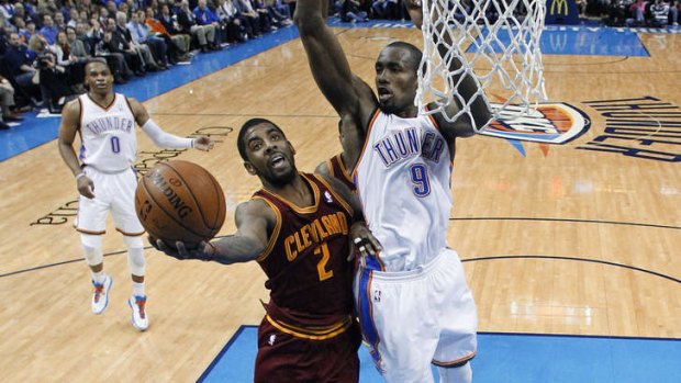 Cleveland Cavaliers guard Kyrie Irving shoots in front of Oklahoma City Thunder forward Serge Ibaka in Oklahoma City. Cleveland won 114-104.