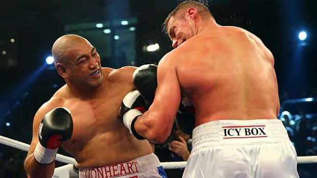 World stage: Alex Leapai (left) in his fight against Russian Denis Boystov in Germany.