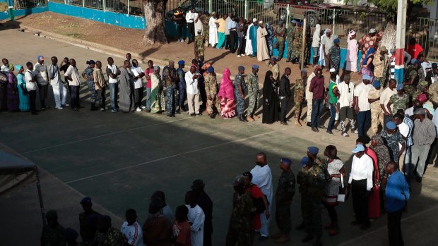 Gambians line up to vote for presidential elections on December 1, 2016.