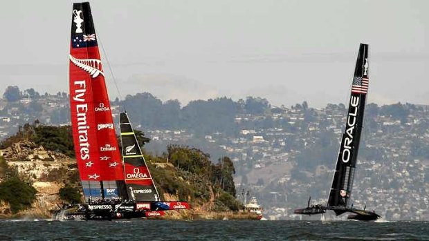Tacking duel: Emirates Team New Zealand (L) and Oracle Team USA sail near Alcatraz Island.