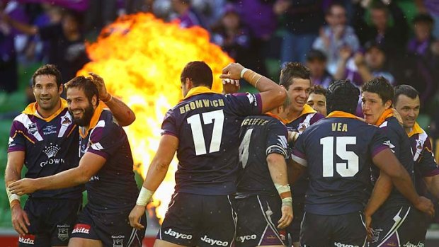 No violence, but still a thrashing: Storm players celebrate a Matt Duffie try during their thumping of the Eels.