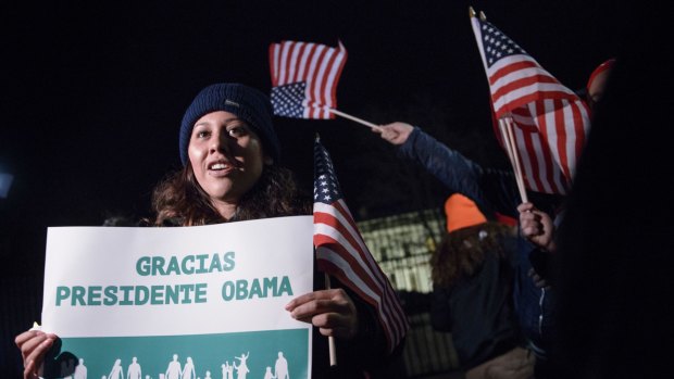Immigration activists applaud President Obama's immigration plan, announced in November.