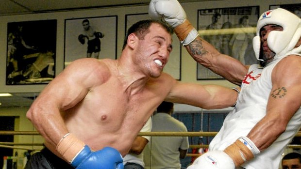 Gurkan Ozkan (left) spars with former world champion boxer Anthony Mundine in Sydney.
