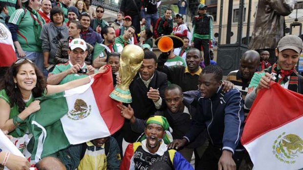 Ready for action .... South African and Mexican fans mingle at Nelson Mandela Square in Johannesburg.