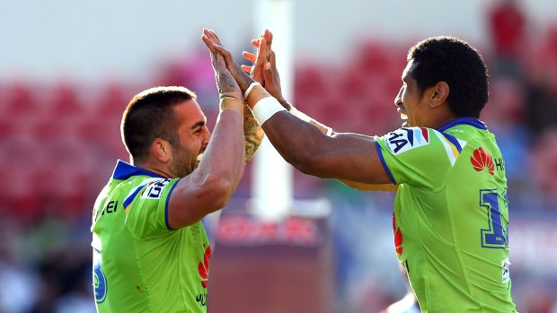 Raiders forwards Paul Vaughan and Sia Soliola celebrate last Sunday's 34-24 win in Penrith. The Raiders have the third-best away record in the NRL this season.