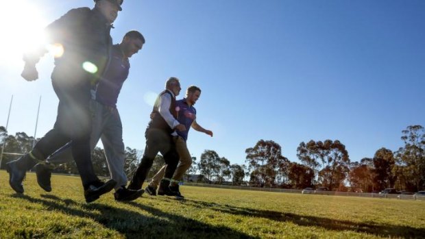 Australian Air Force Wing Commander Michael Rowe, Canberra Raiders' Jake Foster, Habitat Personnel's Gerry Moore and Raider Joel Edwards get some practice before the three-legged race as part of the NRL's Close the Gap Round.