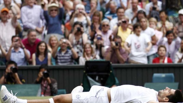 Serbia's Novak Djokovic celebrates after defeating Rafael Nadal of Spain in the men's singles final at Wimbledon.