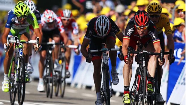 Cadel Evans leads the chase group over the finish line.