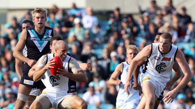 Chris Judd on his way to another three Borwnlow Medal votes against Port Adelaide, round eight, 2010.