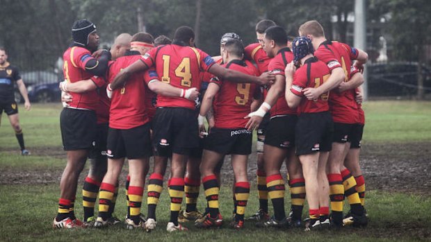 Chris Noble's football team The Dirty Reds wore black armbands at their match yesterday.