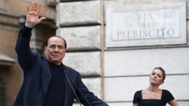 Silvio Berlusconi waving to supporters who rallied against his tax fraud conviction last year.