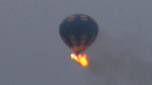 The hot-air balloon crashed after it hit a wire and caught fire and crashed. Three people are believed to have been on board.