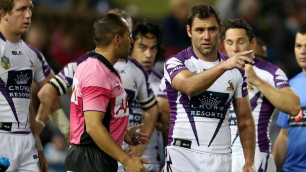 Melbourne Storm captain Cameron Smith in earnest discussion with the referee in Newcastle.