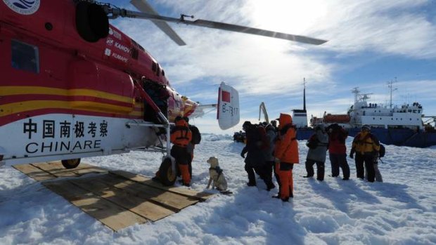 Rescue: Passengers on the Akademik Shokalskiy were transferred to the Aurora Australis by a helicopter from a Chinese icebreaker.