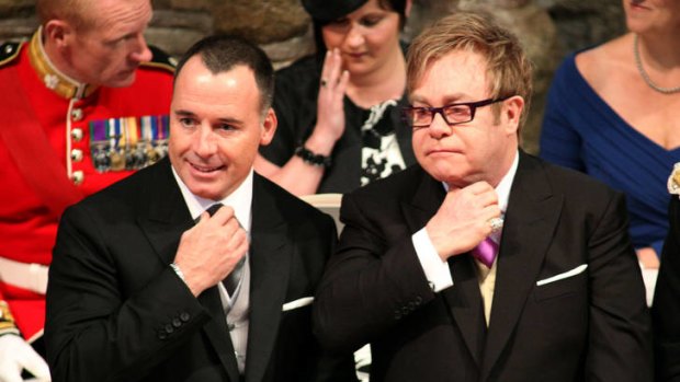 Title in the wings ... Sir Elton John, right, with his partner, David Furnish, at the royal wedding last year.