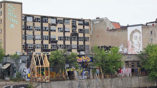 Graffiti on an abandoned building in Friedrichshain on the banks of the River Spree makes the locals' attitude towards the new developments clear.