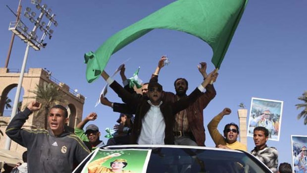 Muammar Gaddafi supporters take to the streets in Tripoli.