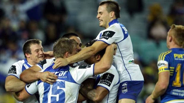 Top Dogs &#8230; the Bulldogs celebrate a try on Friday.