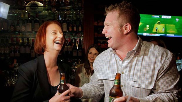 Where everybody knows your name ... the Prime Minister, Julia Gillard, has a beer at The Australian pub in New York with publican Matt Astill on her last night on tour.