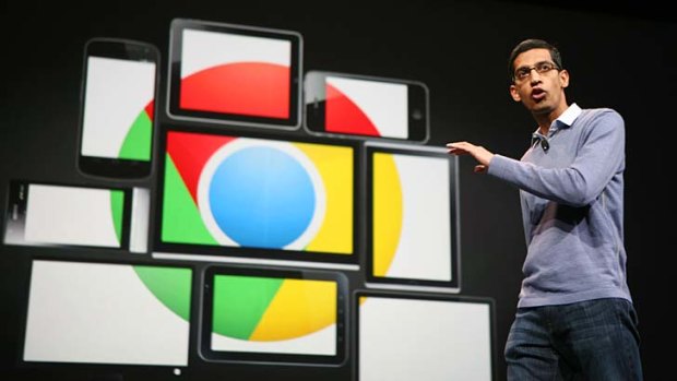 Google chief executive Sundar Pichai, pictured with images of mobile devices bearing the Chrome logo.