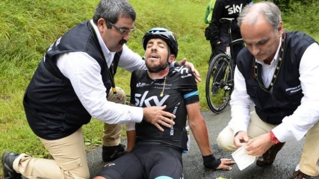 Spain's Xabier Zandio receives medical assistance after a fall during the sixth stage of the Tour de France between Arras and Reims in northern France.