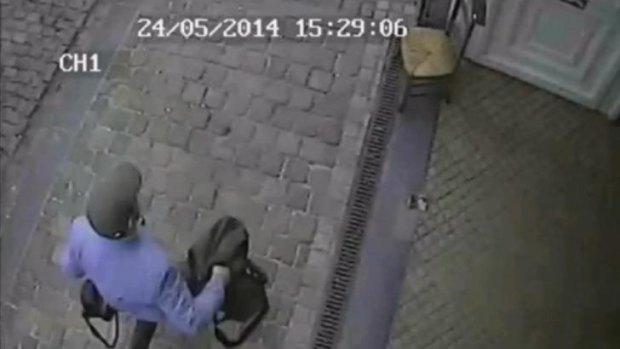 The man believed to be responsible for an attack on a Brussels Jewish museum is captured on CCTV leaving the museum.