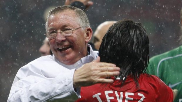 Happier times ... Sir Alex celebrates with Carlos Tevez after winning the Champions League final in 2008.
