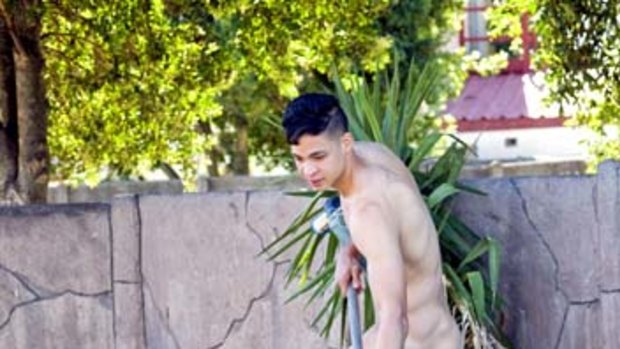 A naked employee cleans the pool at the house of Jean-Paul Reid, a Cape Town resident who in January started a company whose chef hiring policy is a willingness to work in the nude, or mostly so.